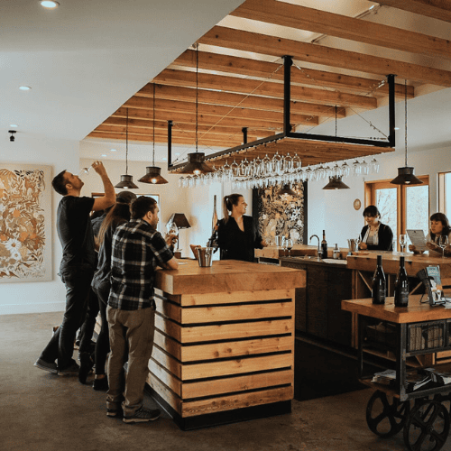 Visit Three Sisters Winery tasting room in a cozy, rustic setting with friendly staff and wine selec.